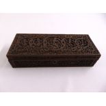 A late 19th century Anglo-Indian rectangular box the hinged cover and sides profusely carved with