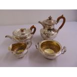 A composite four piece George IV tea and coffee set, part fluted with gadrooned borders on raised