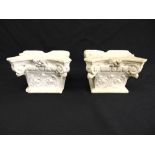 A pair of carved marble Corinthian column capitals