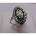 An Art Deco diamond and emerald ring, the central stone approx 1.5ct, tested 18ct, approx total