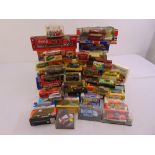 A quantity of diecast cars, trucks, buses, diggers and construction vehicles, all in good