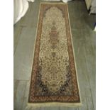 A Persian wool runner brown ground and tan border with repeating floral pattern, 250 x 79cm