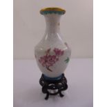 A cloisonné baluster vase inlaid with floral sprays on a pierced hardwood stand