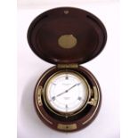 Baume Mercier circular quartz chronometer in polished wood and gilt case