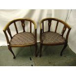 A pair of Edwardian mahogany inlaid slatted back occasional chairs on cabriole legs