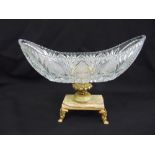 A cut glass oval fruit bowl on raised gilded metal and marble base