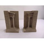 A pair of bookends by Timothy Richards titled Iconic in the form of classical temples