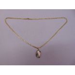 18ct yellow gold necklace with a baroque pearl and diamond pendant, gold tested on pendant 9ct,