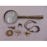 A silver handled magnifying glass and a quantity of costume jewellery