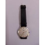 A 1960s Longines gentlemans manual wristwatch, subsidiary seconds dial, stainless steel case on
