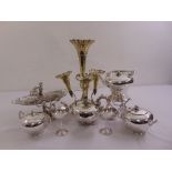 A quantity of silver plate to include a teaset, an epergne and a white metal dish