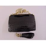An Art Deco black crocodile skin ladies handbag with matching belt