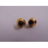 A pair of 18ct gold earrings set with amethyst cabochons, approx total weight 2.2g