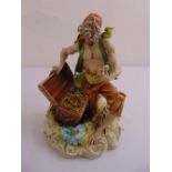 Capodimonte figurine of a pirate with a treasure chest on naturalistic base