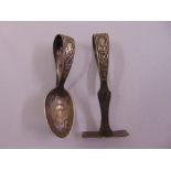 A childs silver plated pusher and spoon