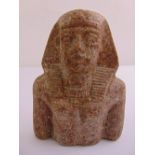An Egyptian carved bust of a pharaoh