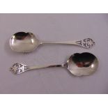 A pair of Edward Viner silver serving spoons with scrolled pierced terminals, Sheffield 1955