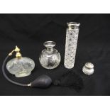 A glass atomiser, a silver mounted scent bottle and two cut glass bottles with silver covers (4)