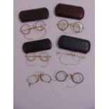 Six pairs of vintage reading glasses to include four cases