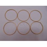 Six gold bangles, tested 18ct, approx total weight 56.5g