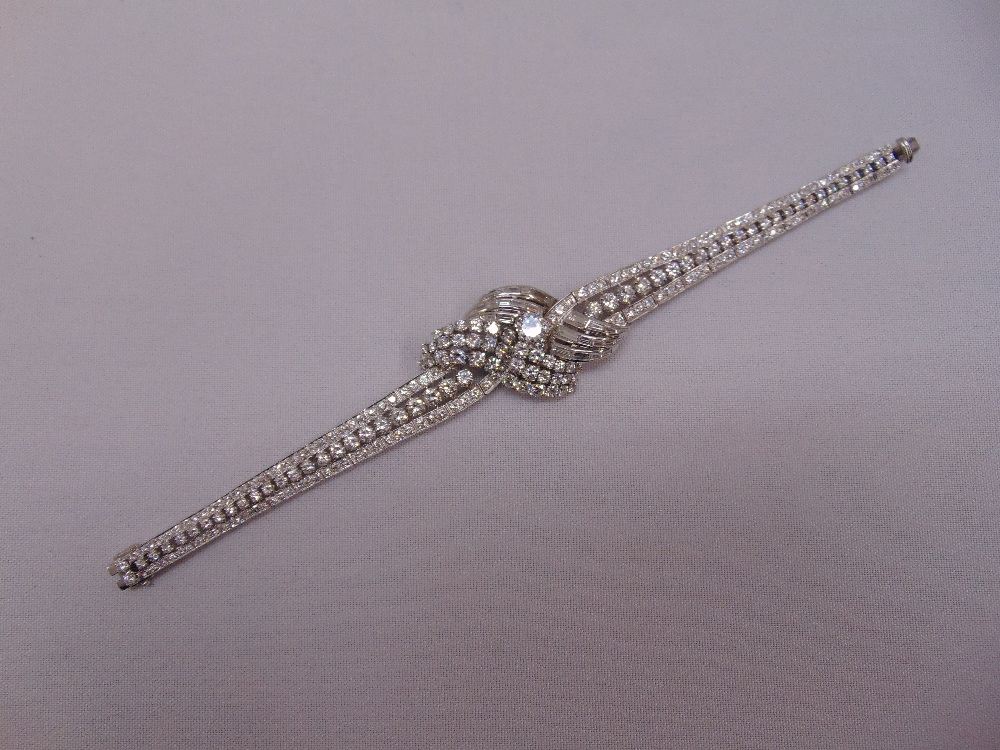 An Art Deco platinum and diamond bracelet, approx 13cts of diamond, centre stone approx 1ct, overall