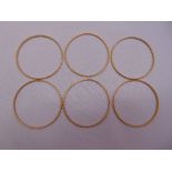 Six gold bangles, tested 18ct, approx total weight 56.0g