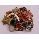 A quantity of costume jewellery to include necklaces, brooches, rings, bags, bracelets