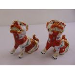 A pair of Herend Dogs of Foe figurines, marks to the base
