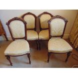 Four Victorian upholstered dining chairs on tapering fluted baluster legs
