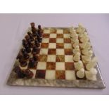 A coloured stone chess set and board