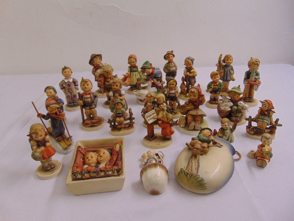 A quantity of Hummel and Goebel figurines and three wall plaques (27)