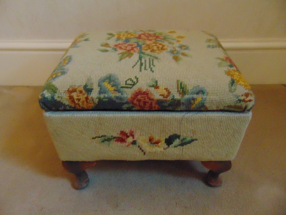 A Victorian upholstered foot stool cum sewing box with accessories on four scroll feet