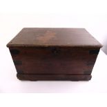 An early 19th century rectangular mahogany chest with metal mounts and brass handles