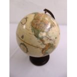 A Replogle world classic polychromatic table globe on turned wooden base