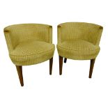 A pair of Art Deco tub chairs with upholstered seats and backs on four tapering cylindrical legs