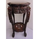 A Chinese 19th century hardwood shaped circular side table with inset marble top the sides and