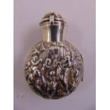 A glass scent bottle with drop stopper in hinged silver case chased with figures and with hinged