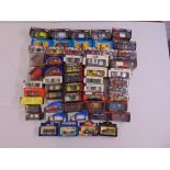A quantity of diecast cars and vans all in original packaging (54)