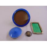 A silver and enamel pin tray, a silver and enamel photograph frame and dressing table bottle cover