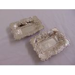 A pair of rectangular silver nut dishes chased with fruits, scrolls and leaves, Chester 1901