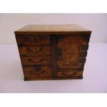 A miniature rectangular Japanese wooden table cabinet with inlaid parquetry