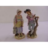A pair of continental figurines of a farm boy and a girl with a watering can, marks to the base