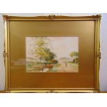 William Outhwaite a pair of framed and glazed watercolours of English country landscapes, signed