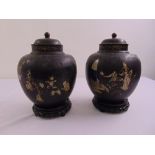A pair of Chinese treated metal vases and covers inlaid with figures and stylised vegetation A/F
