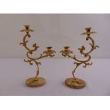 A pair of gilded metal and marble two branch candelabra of naturalistic form