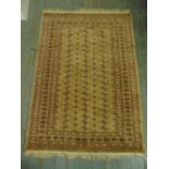 A Persian wool carpet tan ground with geometric repeating pattern and border, 175 x 129.5cm