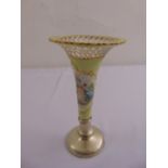 A porcelain vase with lattice pierced top decorated with ladies to the side on hallmarked silver