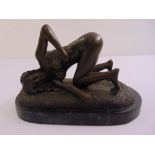 John Koch bronze figure of a recumbent lady, signed to base, on black marble plinth