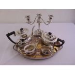 A quantity of silver plate to include a gallery tray, a four piece tea and coffee set and a
