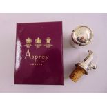 An Asprey silver plated wine bottle funnel and champagne stopper in fitted presentation box